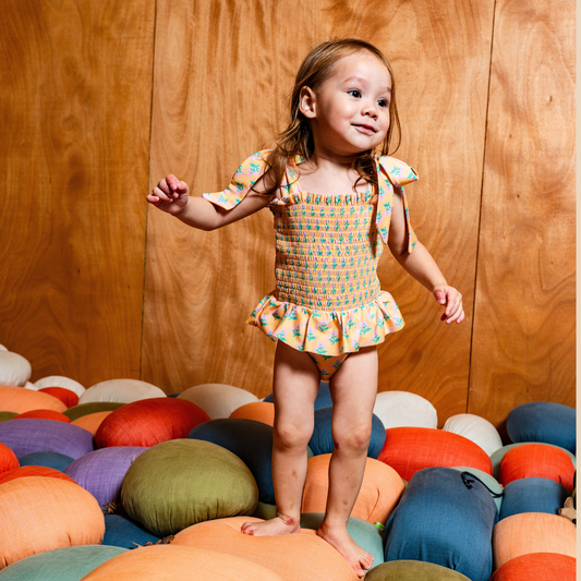 Sophia Smocked Tie Swimsuit in Marigold Bloom
